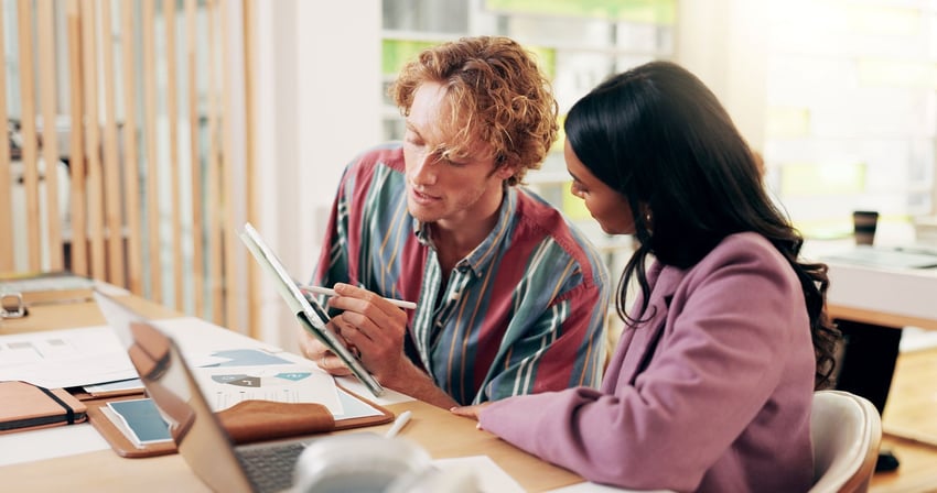 A financial planner helps a young person plan out their financial future