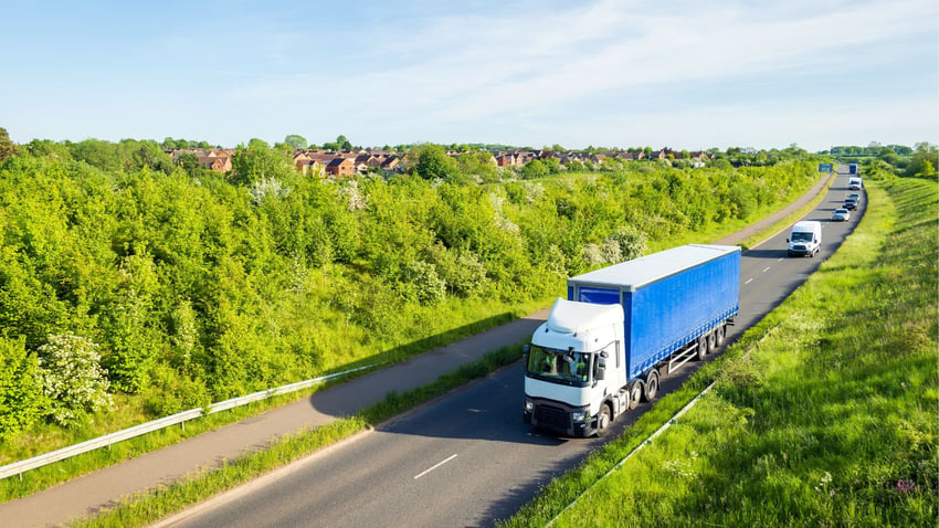 Financial Planner Callum Mccarthy lorry driving to financial advising LIBF learner on the road in a lorry driving to change his career