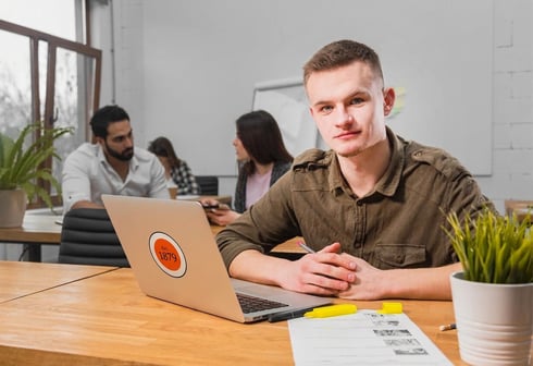 Walbrook apprentice with Walbrook logo on his laptop