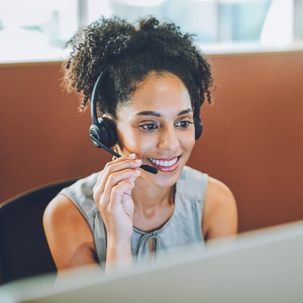 Woman talking to user of a headset