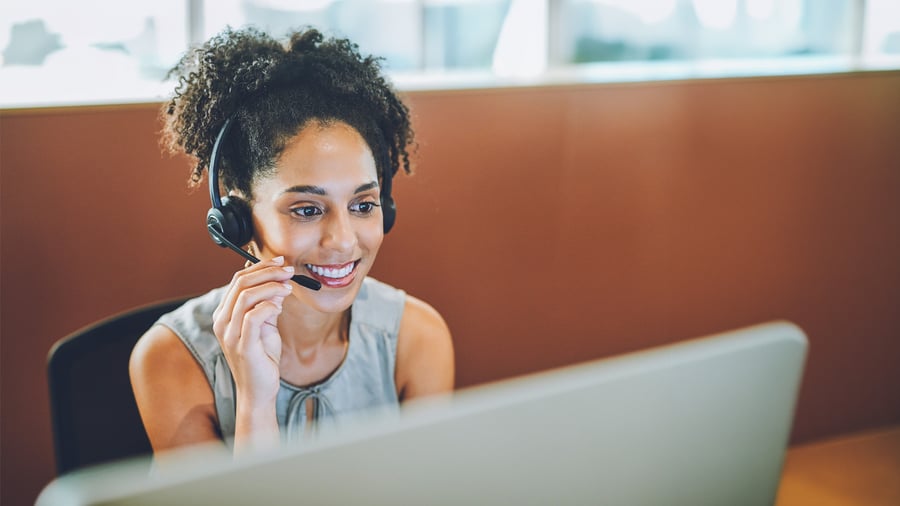 Woman talking with user over a headset