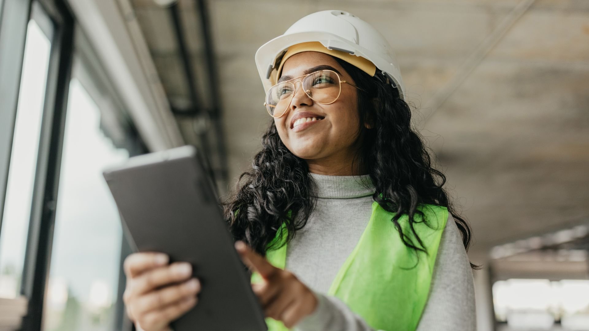 Woman using iPad in outdoor facility