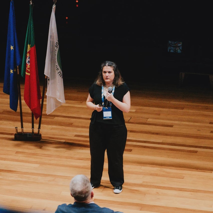 Women on stage presenting