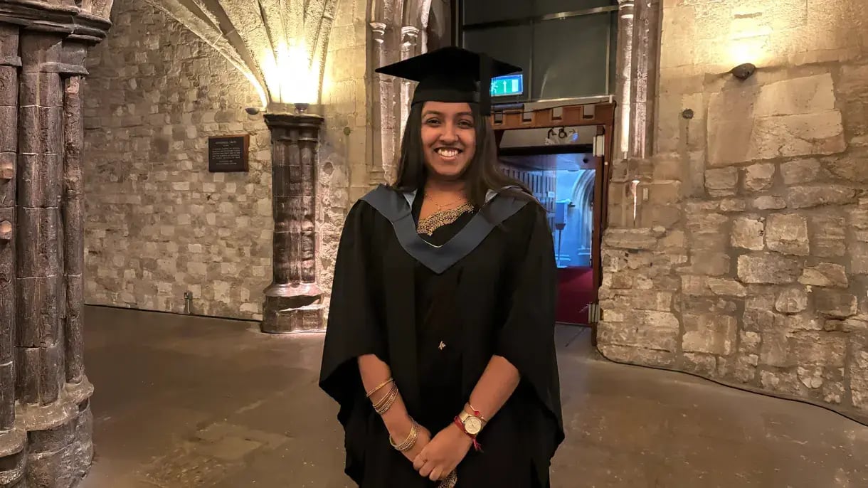 Student smiling at graduation