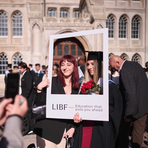 Walbrook students holding polaroid cut-out at graduation 2024