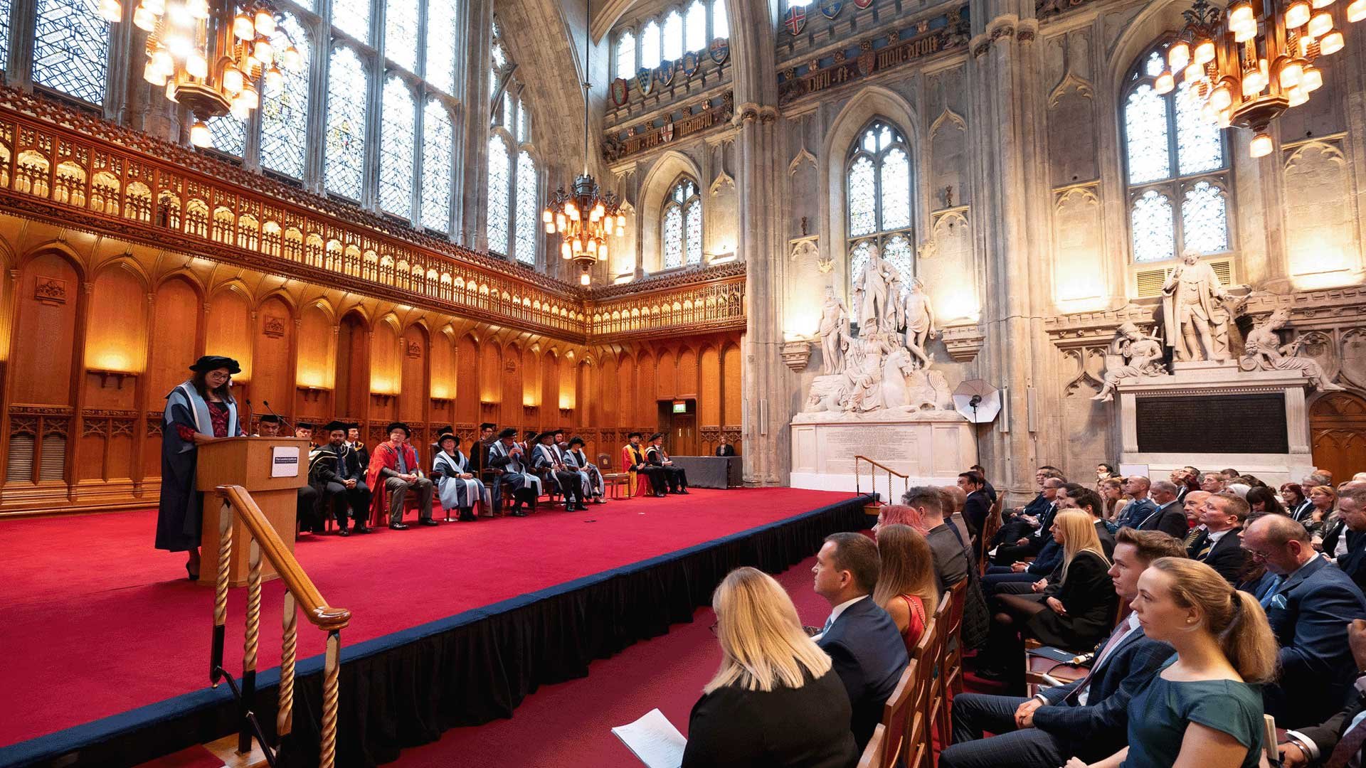 Wide angle photo of a student speaking at Graduation and Presentation Ceremony in London Guildhall