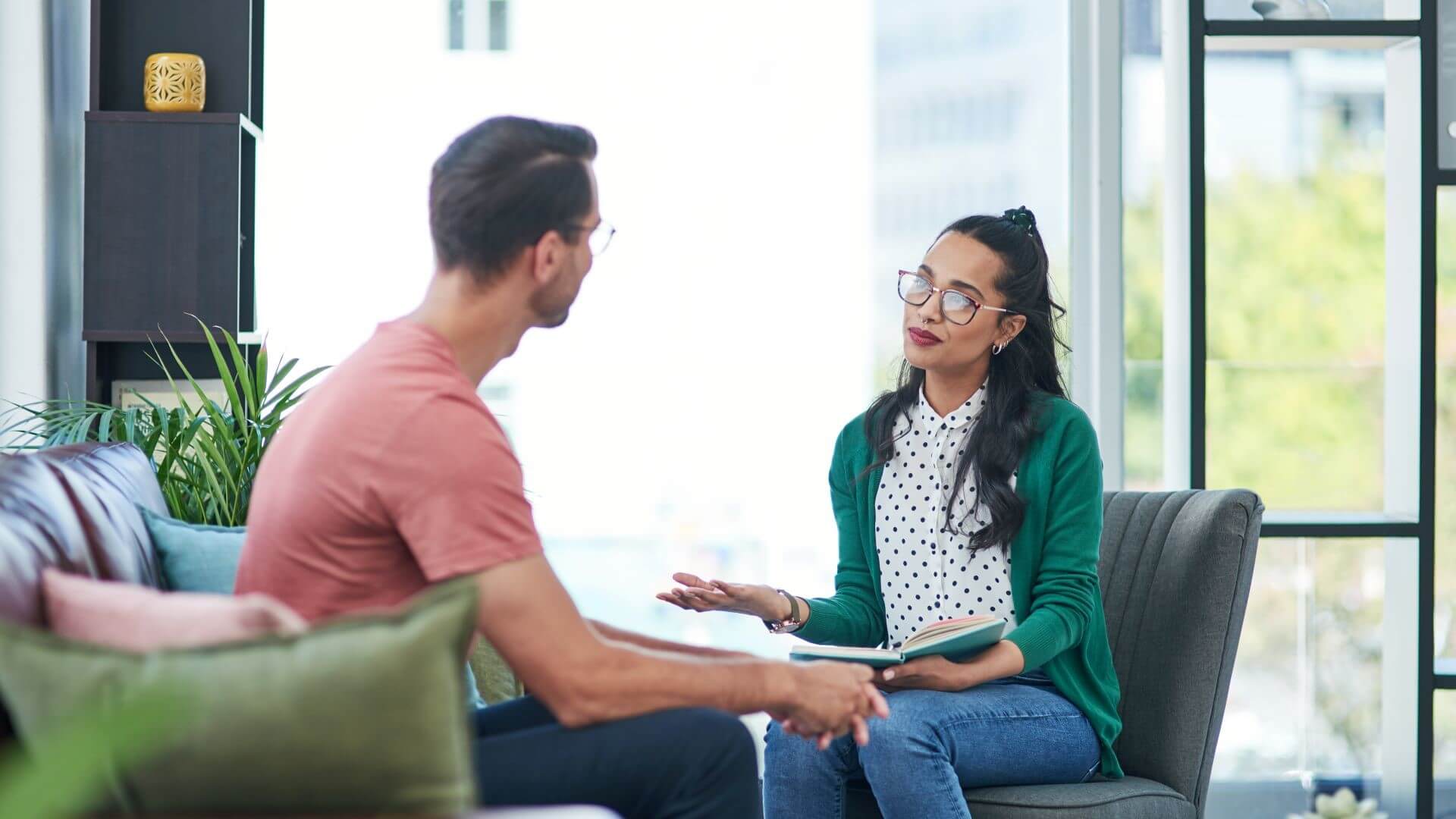 Developers discussing the use of an open source programming language as part of agile software development project.