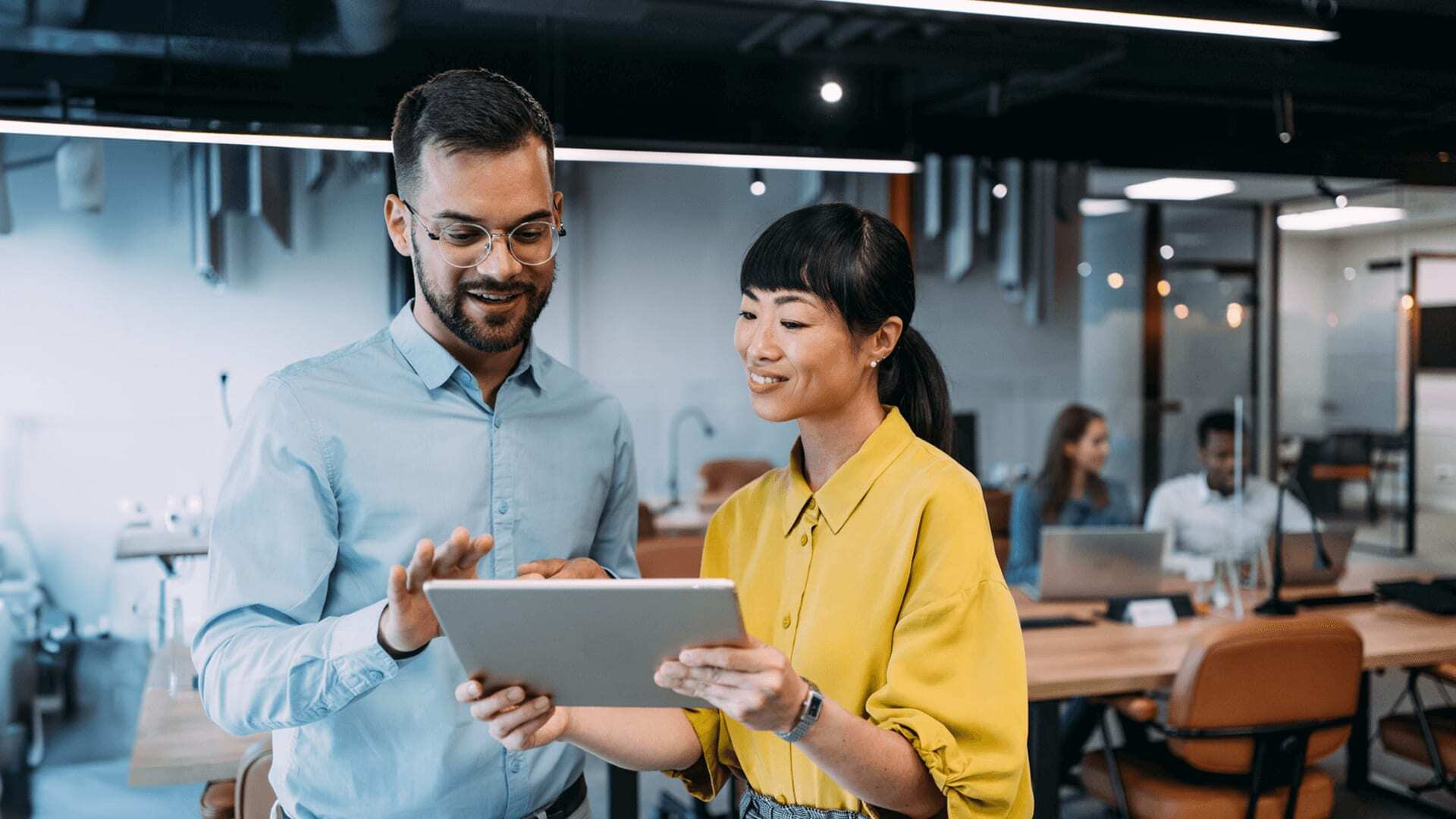 Software developers collaborating on a website project using agile development methods and C++ programming language.