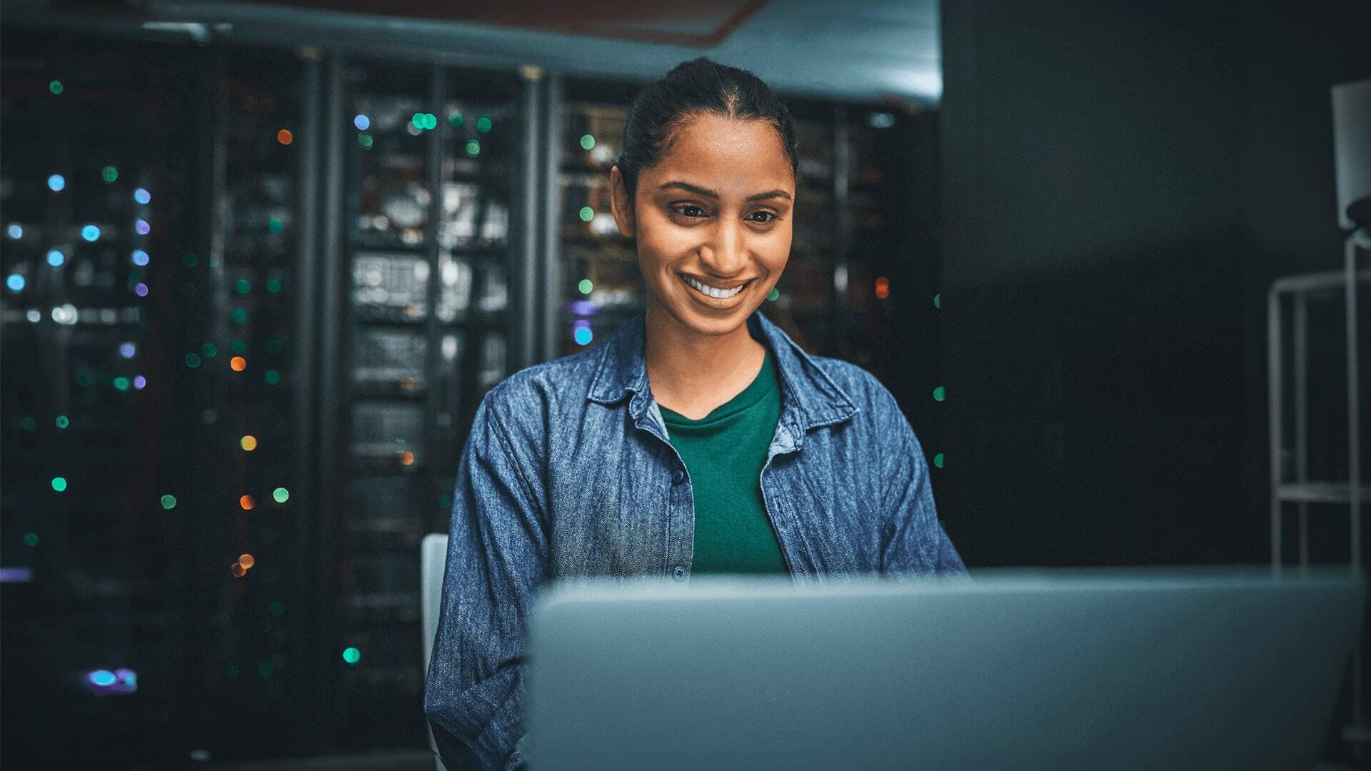 A Cyber Security Engineer setting up computer security networks to stop cyber criminals from security threats to computing databases.