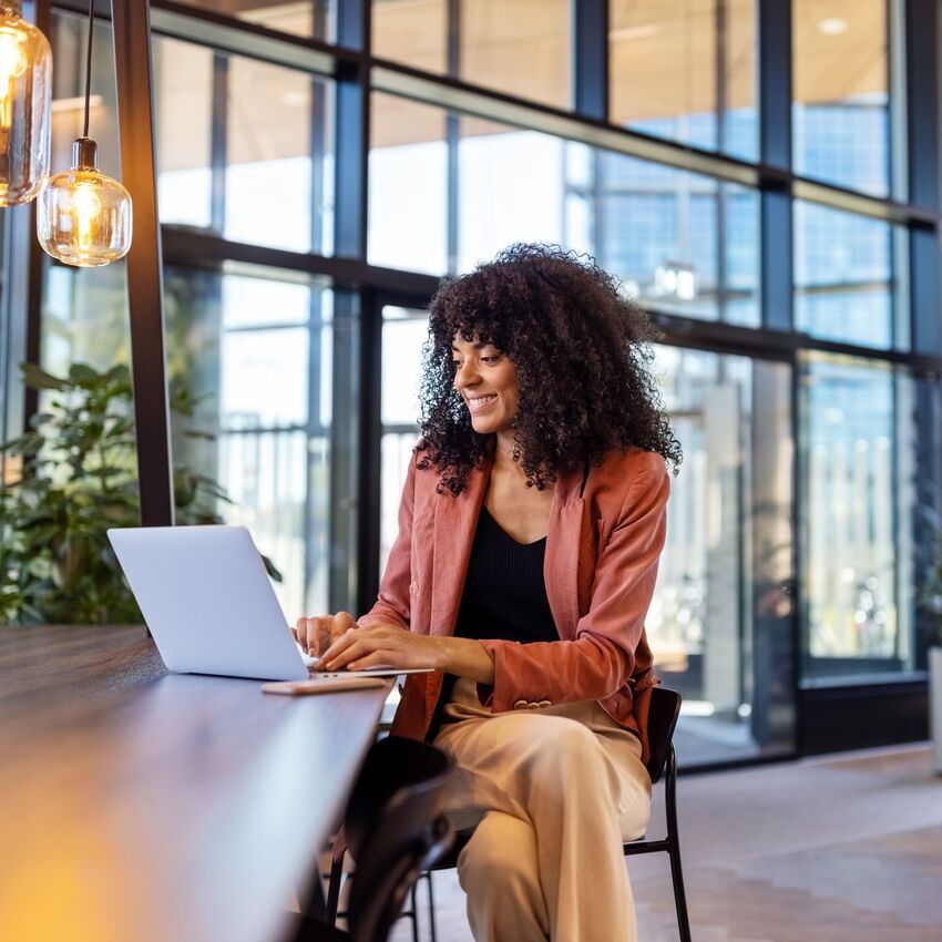 Woman using a laptop in a casual environment