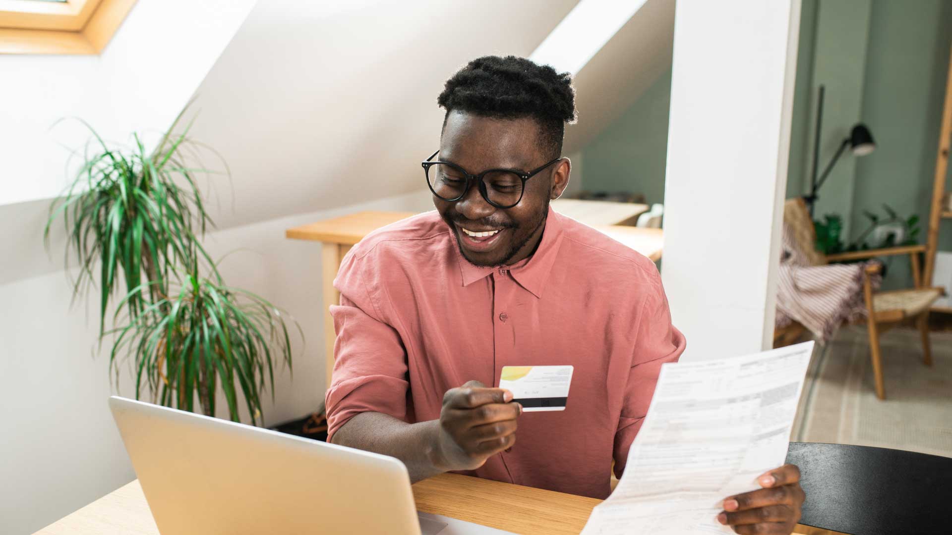 Student applying at home on a laptop as part of a flexible Walbrook online MBA programme.
