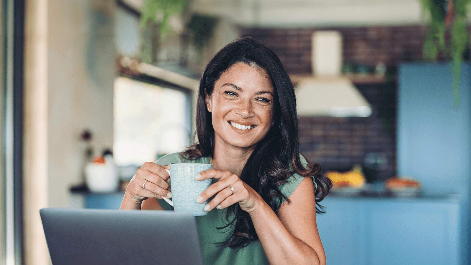 Happy woman drinking her coffee is ready to pursue higher education.