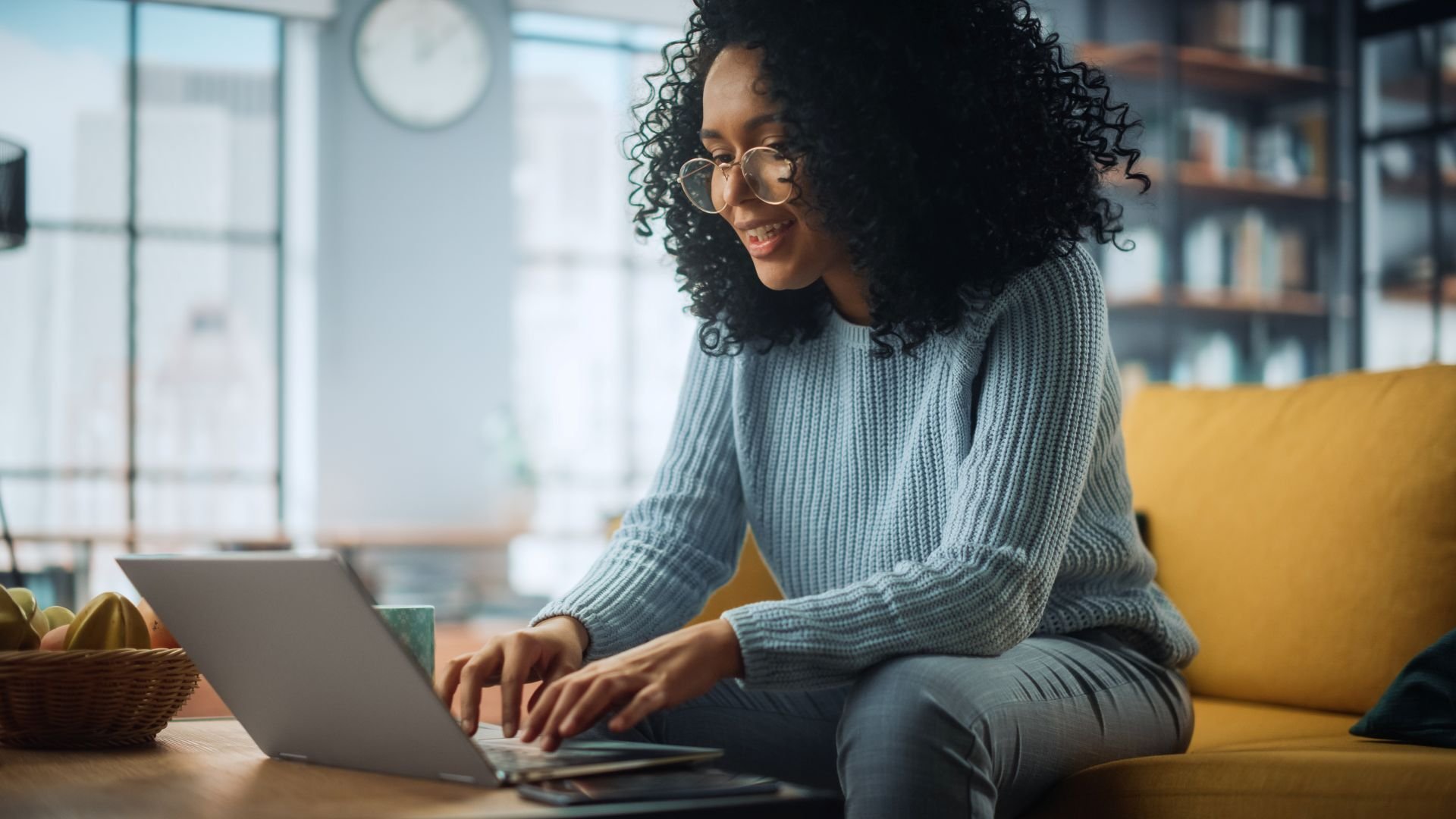 Woman studying on her laptop from home environment