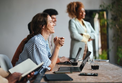 Woman smiling during work meeting