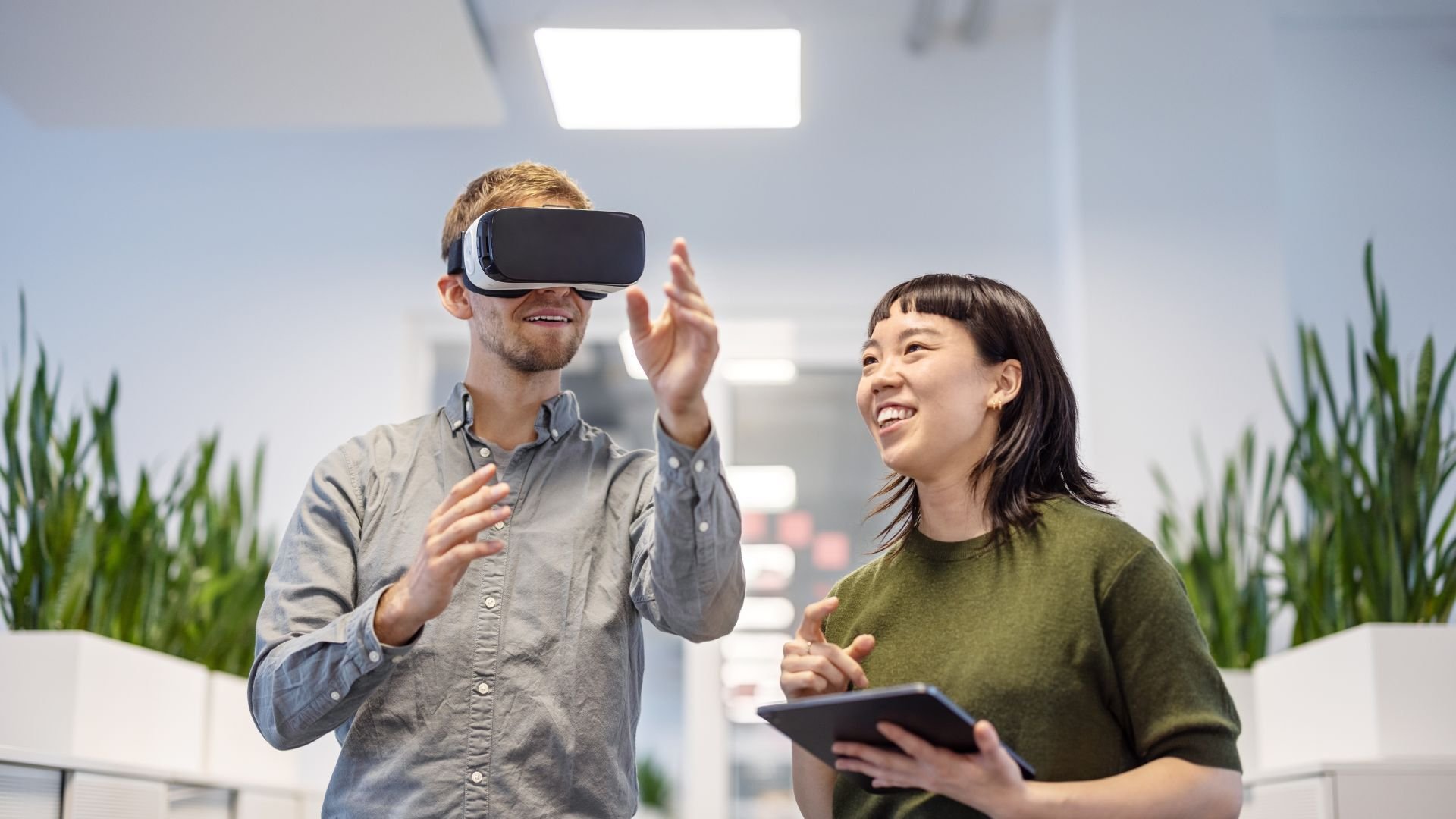 Coworkers trying out a VR Headset
