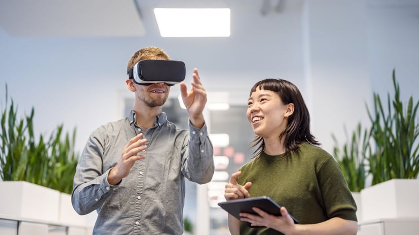 Coworkers trying out a VR Headset