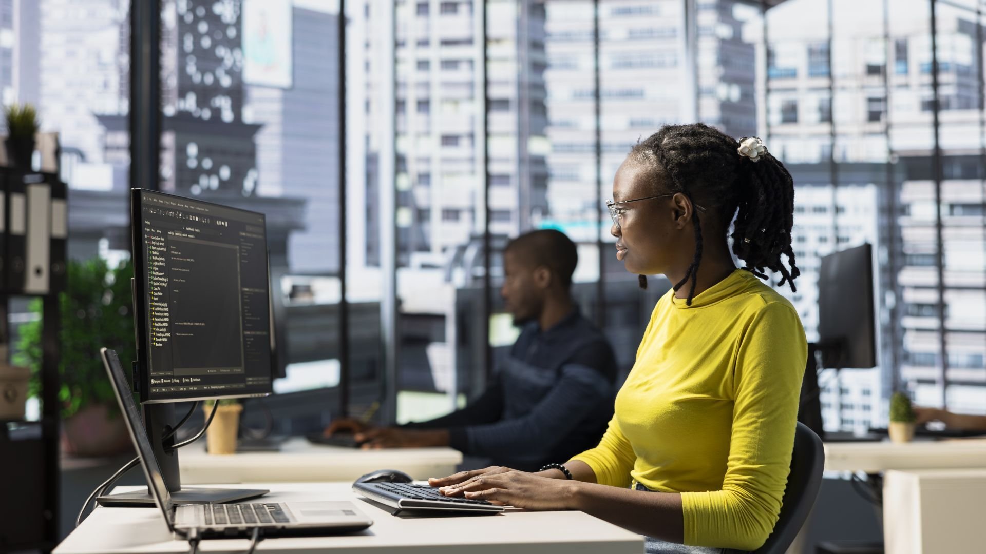 Woman using computer in office environment