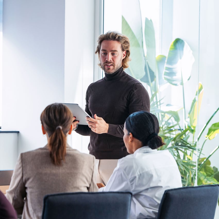 Man giving a talk in office setting