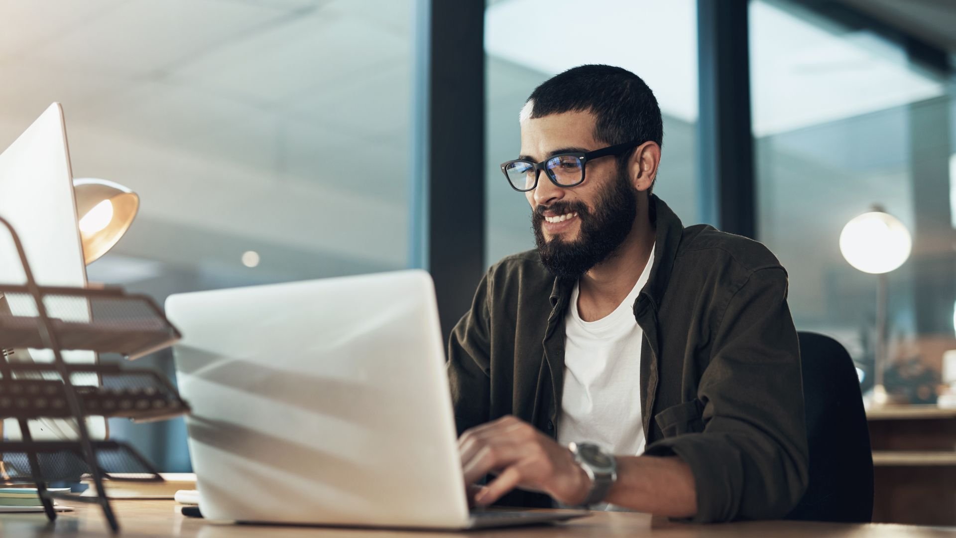 Man working on his laptop in home environment