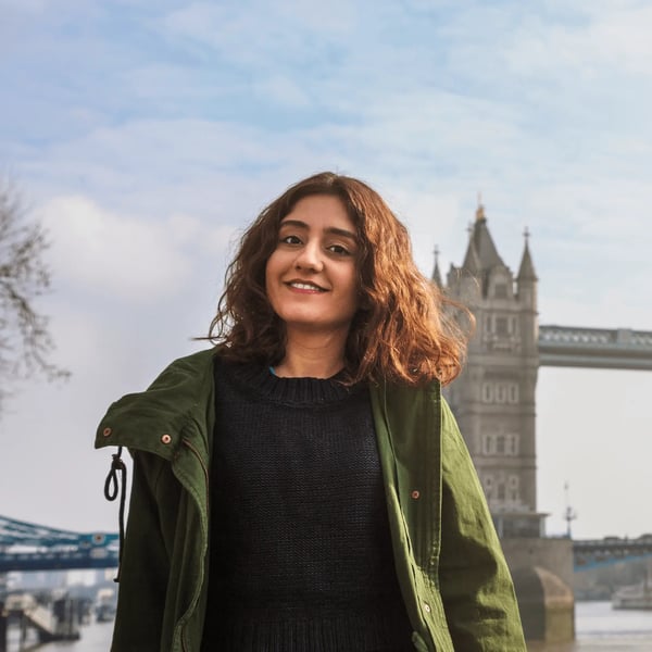 Young student stood in front of London Tower Bridge near the Walbrook office.