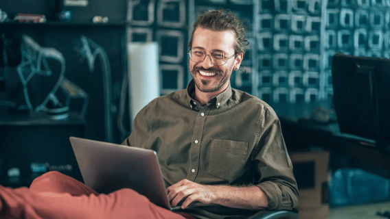 Cyber security analyst studying a computer science degree online at home.