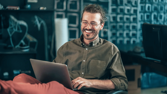 Cyber security analyst studying a computer science degree online at home.