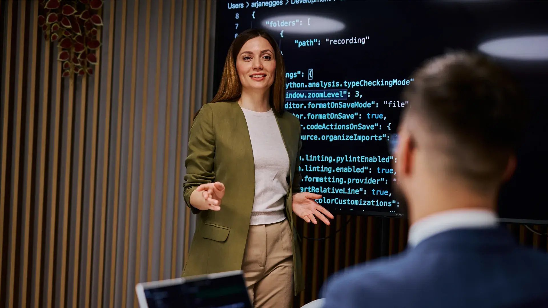 A young professional presenting a project on machine learning algorithms.