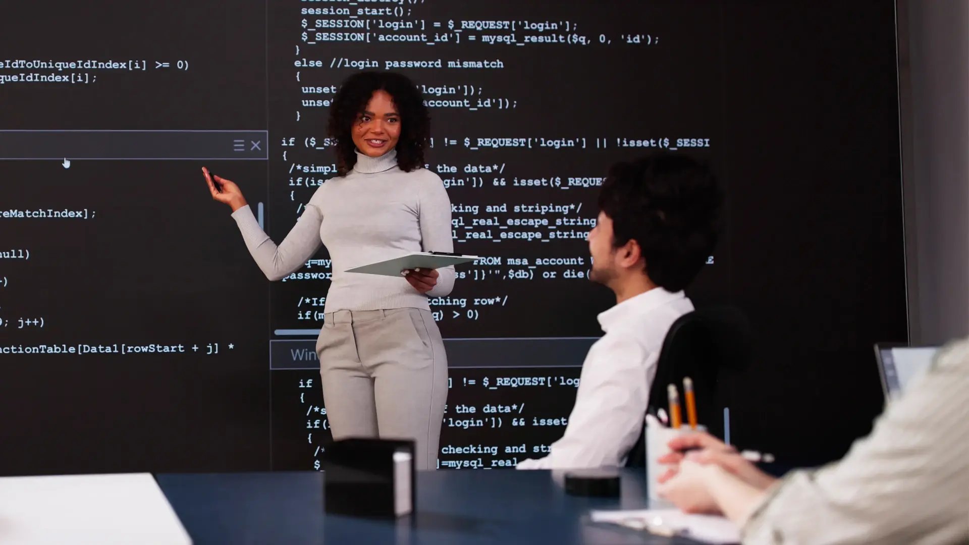 Professional woman explain theoretical knowledge and programming behind data analysis.