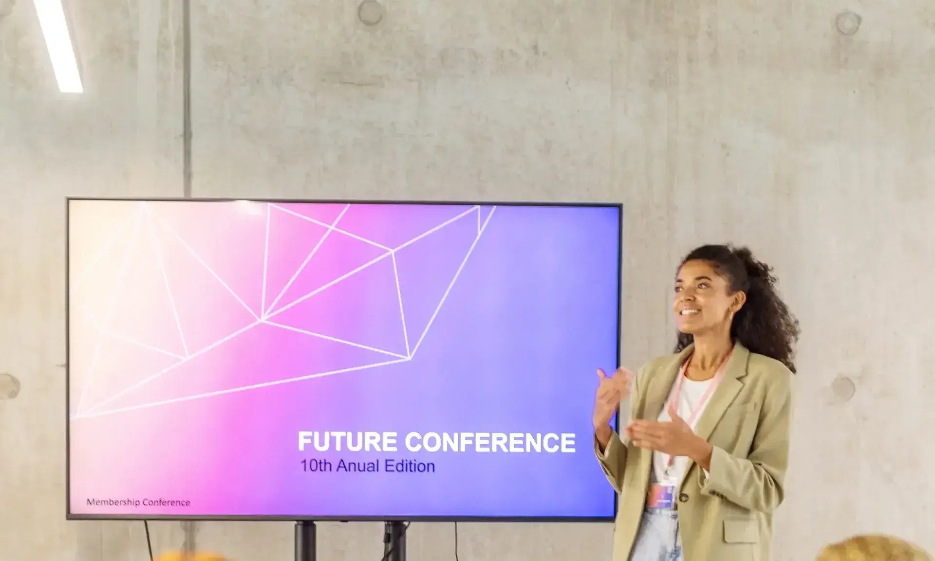 A confident business leader speaking at a deep learning conference about AI.