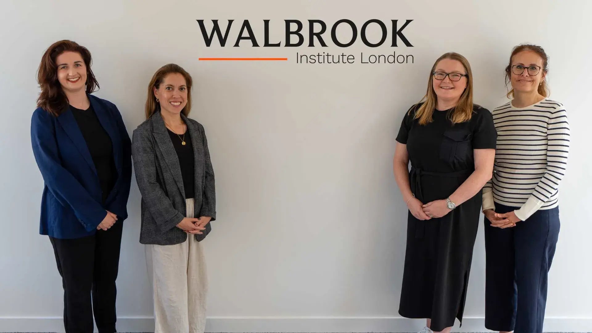 Walbrook Careers team stood in front of Walbrook logo