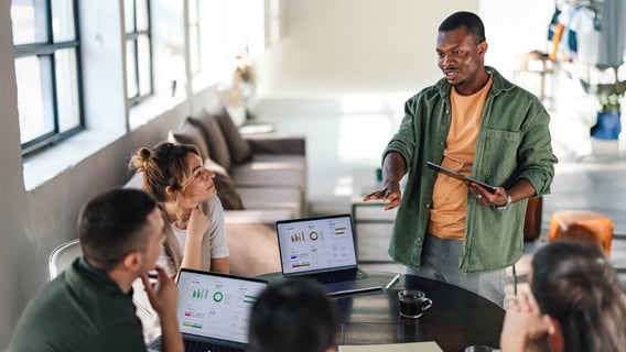 A professional working with charts on a laptop, linked to analytics and insight roles after an MBA Data Analytics.