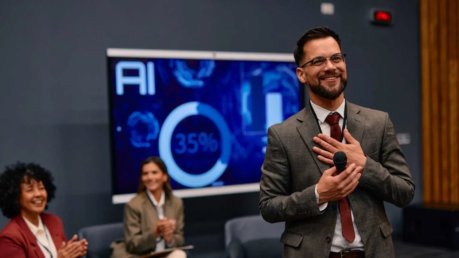 Smartly dressed strategy lead pitching ideas for AI solutions and responsible AI adoption.