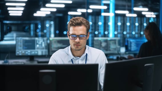 A professional working in a cyber security control room, representing careers after an MBA Cyber Security.