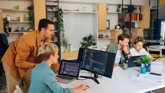 Group of colleagues working in data science develop research to apply to computer architectures.