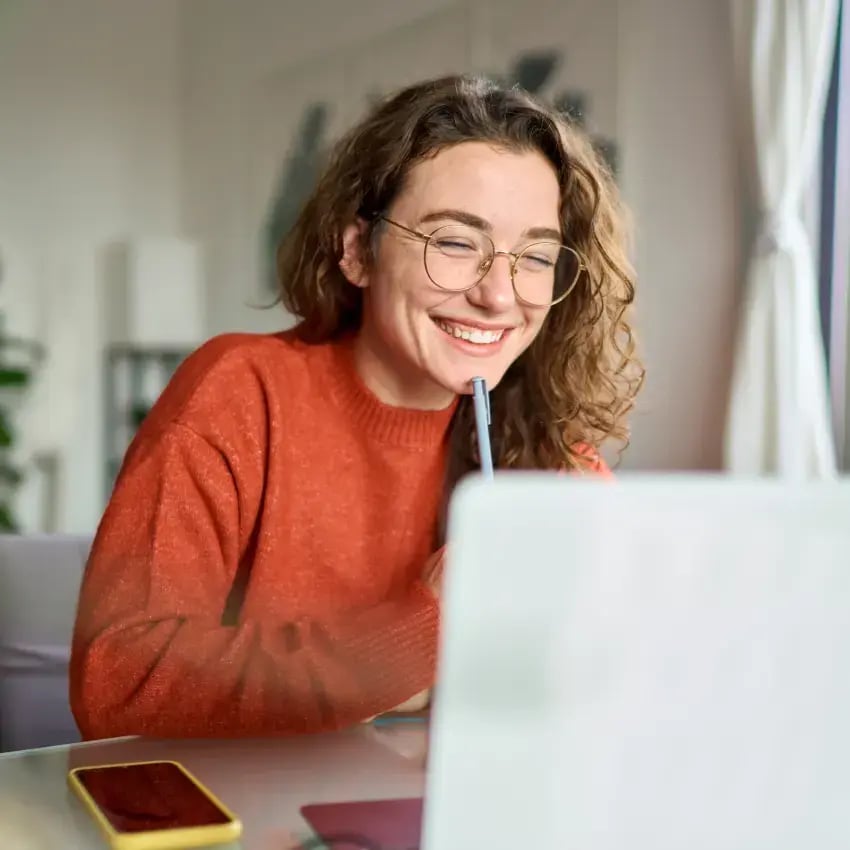 Young woman using laptop at home