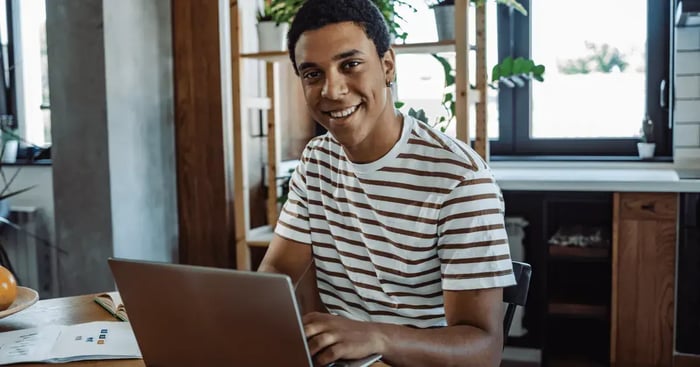 Male student studying from home starting their degree in january