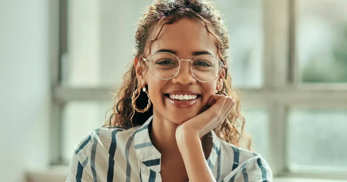 Woman learning how to become an IT consultant in home office with online degree.